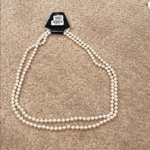 Long faux pearl necklace. NWT.
